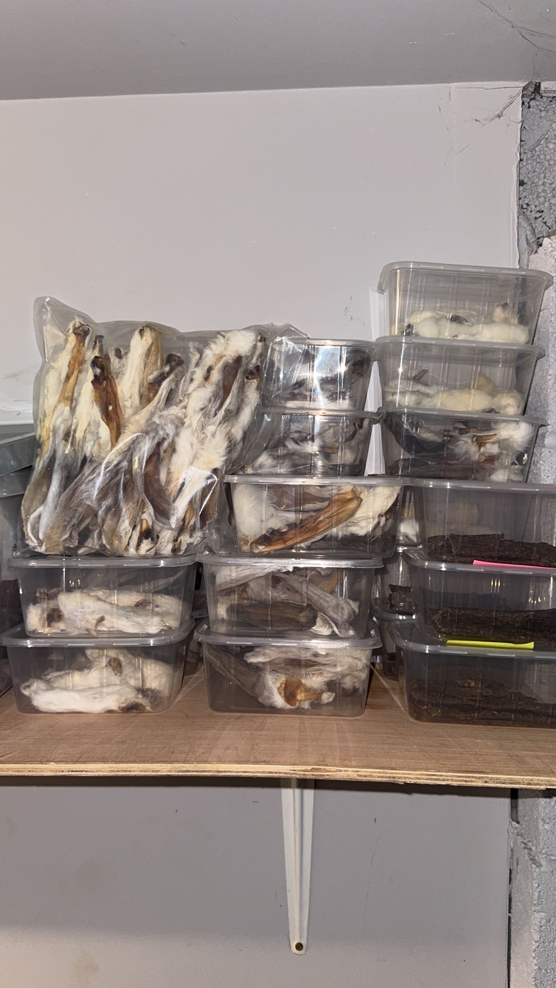 Shelves of tubs of dried natural dog treats ready to go out